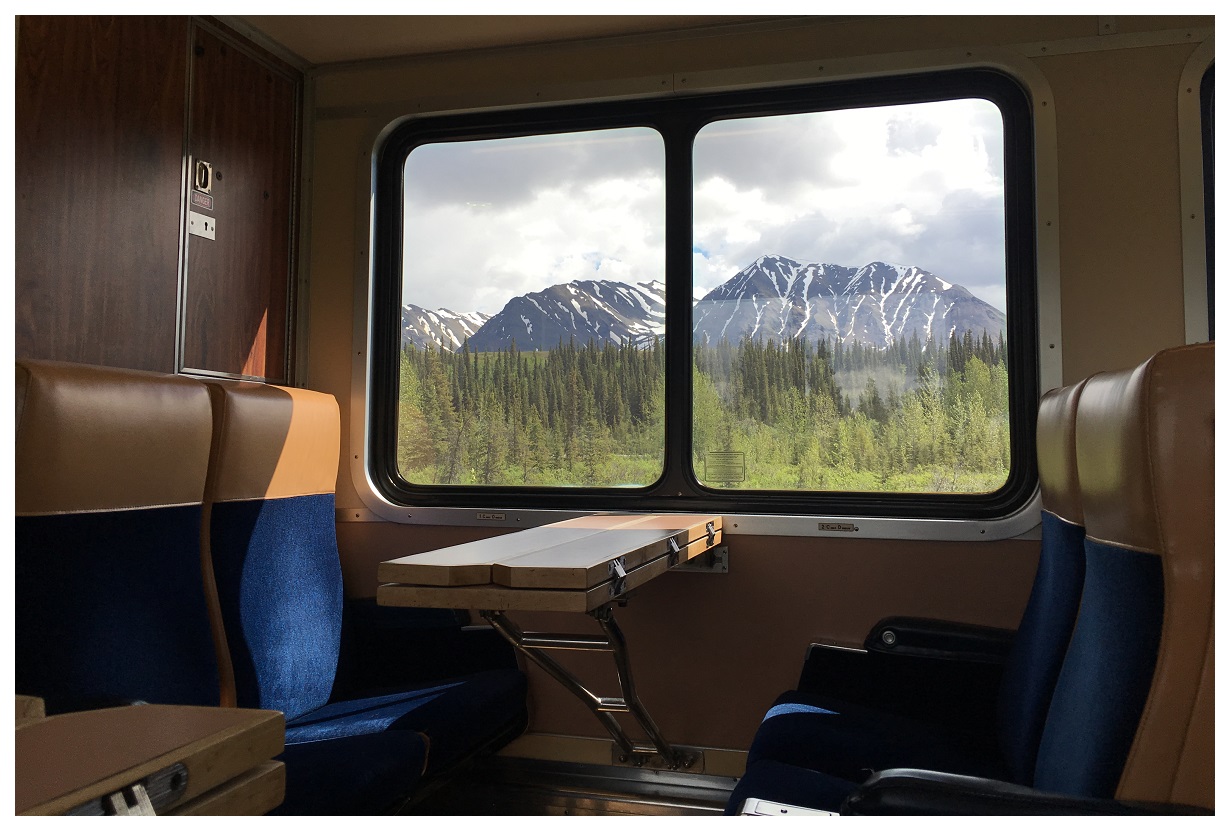 View of the mountains through a train window