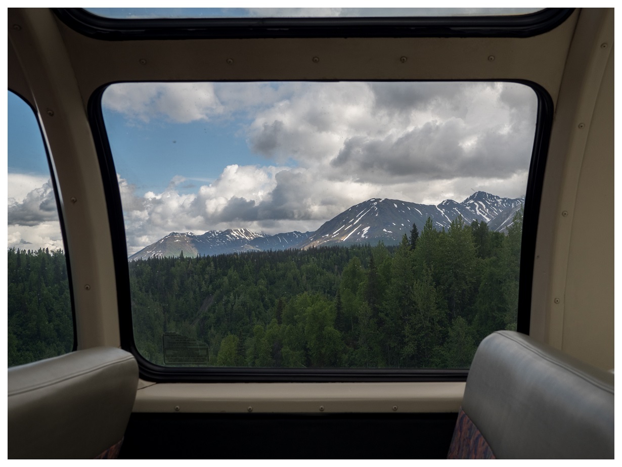 A view from the side of the dome car, coming into the train station for Denali National Park.